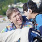 Father,And,Disabled,Five,Year,Old,Son,Laughing,Together,On