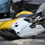Yellow black motorcycle broken after an accident