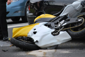 Yellow black motorcycle broken after an accident